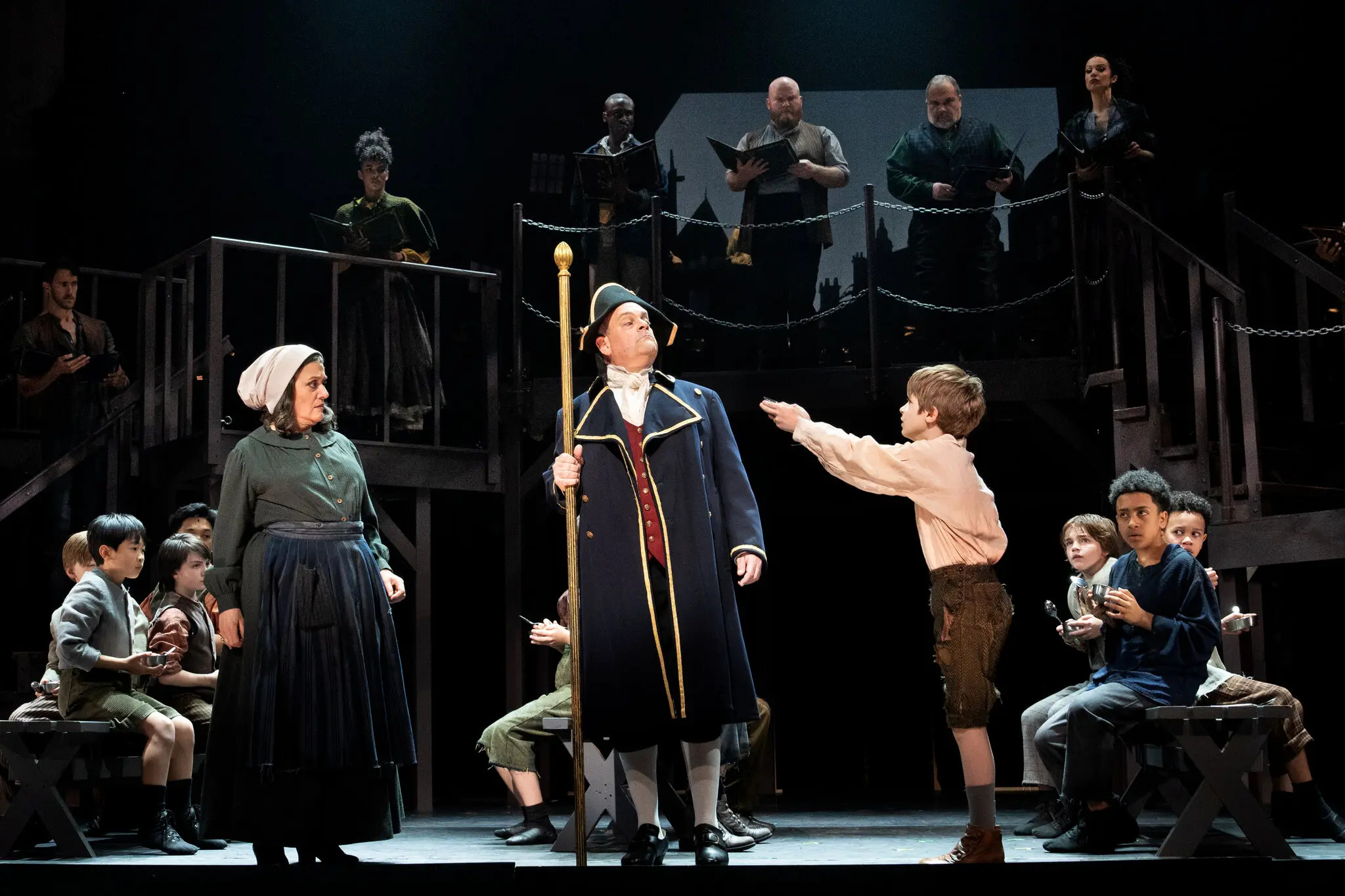 Mary Testa as Widow Corney, Brad Oscar as Mr. Bumble and Benjamin Pajak as Oliver, with in the Encores! production of “Oliver!” at New York City Center. Credit Sara Krulwich/The New York Times
